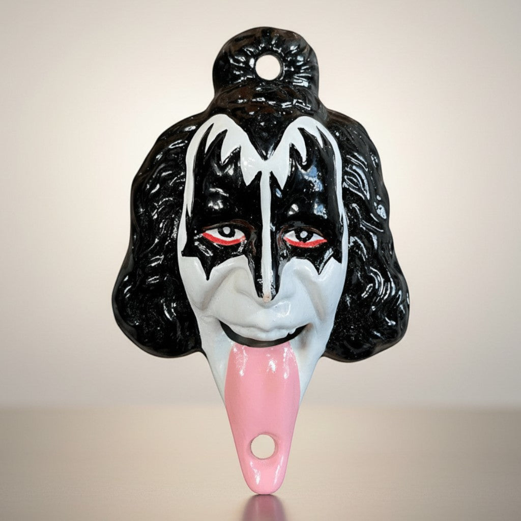 Jones Peak black and white cast iron bottle opener shaped like Gene Simmons' face with a pink tongue.