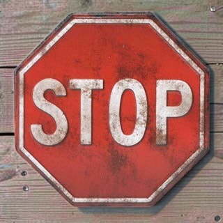 Stop Sign Red Embossed Metal Magnet detail view