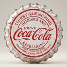 Coca-Cola weathered bottle cap metal sign with distressed red and white logo design