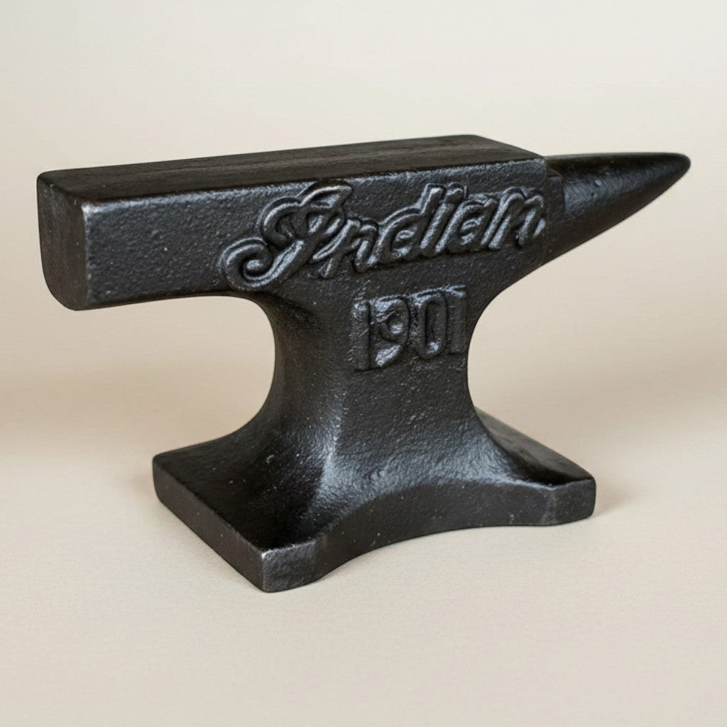 Jones Peak 1901 Indian Motorcycle cast iron anvil paperweight with distressed antique finish.