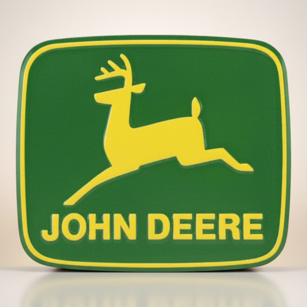 Jones Peak John Deere logo metal magnet, green with yellow deer and text. Vintage collectible accent.