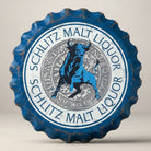 Schlitz Bull bottle cap metal sign with blue bull graphic and distressed blue and white finish