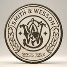 Jones Peak Smith & Wesson vintage round metal magnet with S&W logo and "Since 1852 Springfield, Mass."