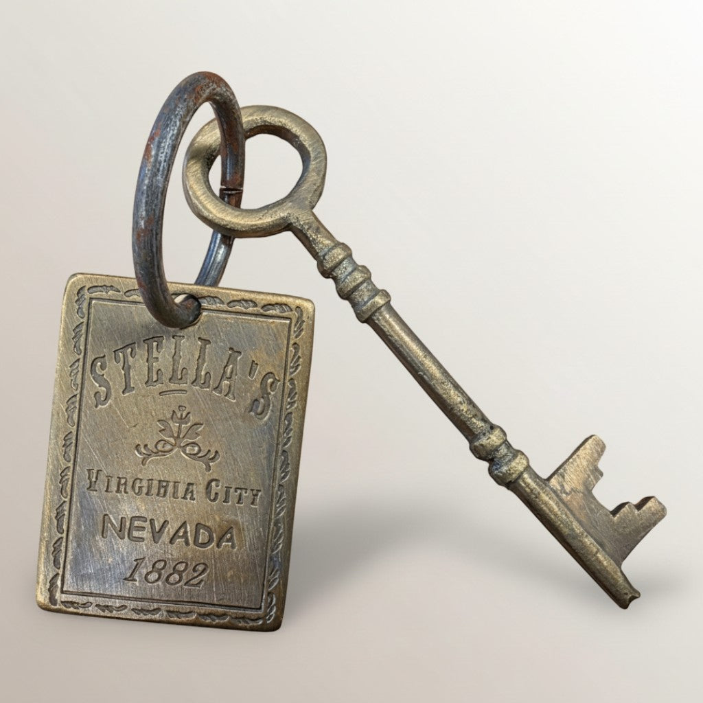 Jones Peak Stella's Virginia City Brothel brass room tag and key, 1882, distressed antique finish.