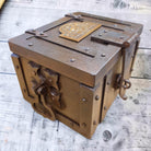 Jones Peak Winchester 1866 cast iron strong box with brass tag, distressed finish, decorative storage.