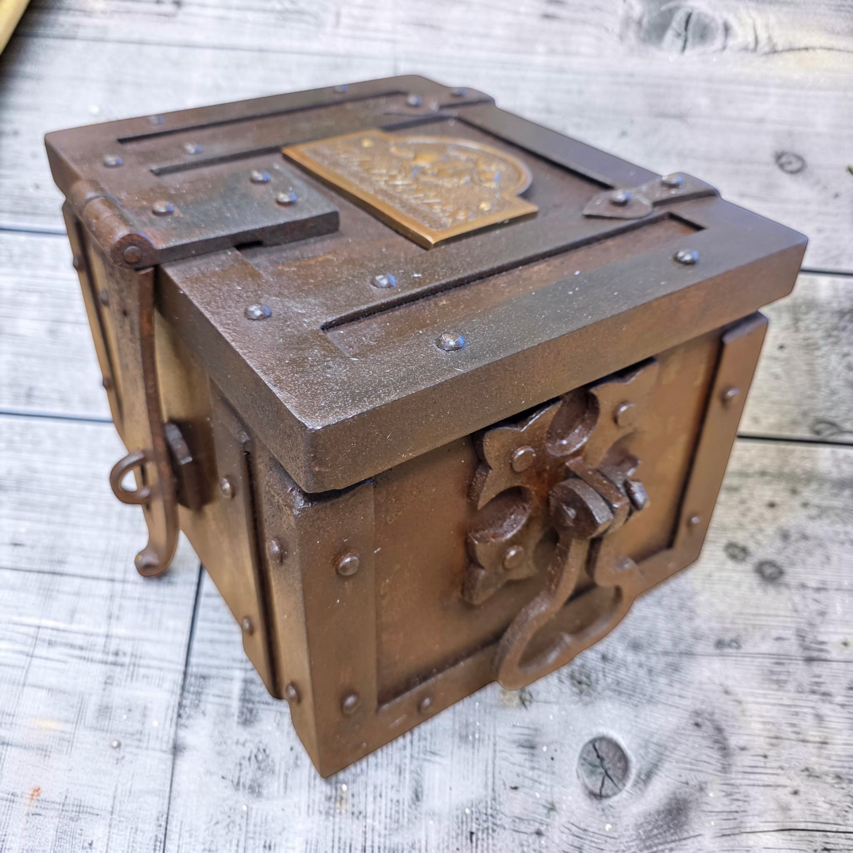 Jones Peak Winchester 1866 cast iron strong box with brass tag, distressed finish, decorative storage.