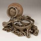 Jones Peak Alcatraz Prison cast iron ball and chain leg irons, a decorative reproduction with an antique finish.