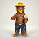 Jones Peak Smokey Bear cast iron coin bank with shovel, hand-painted antique patina finish.