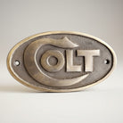 Jones Peak Western Firearms solid brass plaque with raised COLT lettering and antique patina finish.