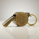 Jones Peak solid brass fire department whistle with raised F.D. and laurel wreath detail, hand-antiqued finish.