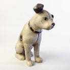 Jones Peak cast iron dog coin bank with antique patina finish, wearing a studded collar.