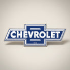 Jones Peak Chevrolet logo embossed metal magnet, blue and white vintage design.