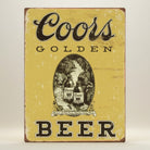 Jones Peak COORS Golden vintage metal sign with distressed yellow finish and classic beer bottles graphic.