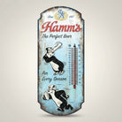 Jones Peak Hamm's Perfect Beer embossed metal thermometer with vintage cartoon bears playing baseball and football. Blue distressed finish.
