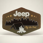 Jones Peak Jeep camping embossed metal magnet with tent, campfire, and mountains. Features "Jeep Off the Grid" text.