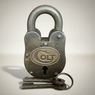 Jones Peak Old West cast iron lock with keys, decorative reproduction with antique finish and 'COLT' emblem.