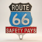Jones Peak Route 66 Safety Pays aluminum license plate topper with antique patina finish.