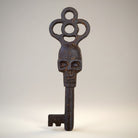 Jones Peak cast iron decorative key with skull detail and antique finish. 5" long.